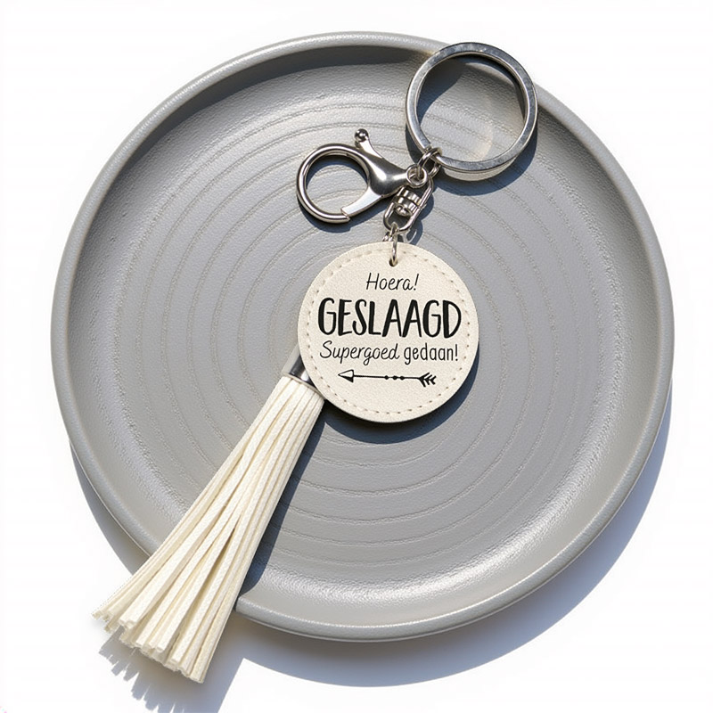 TASSEL GESLAAGD SLEUTELHANGER